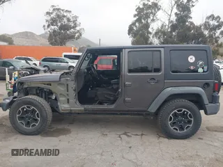2014 Jeep Wrangler Unlimited Sport with VIN 1C4BJWDG7EL244749, listed as a IAAI auction lot 41871127 with 128,420 mi miles and . Bid and sale history available at DreamBid. Image 15.
