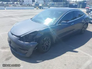 2018 Tesla Model 3 Long Range Battery with VIN 5YJ3E1EA9JF042319, listed as a IAAI auction lot 41871931 with 138837 miles. Bid and sale history available at carsss.com. Image 2.
