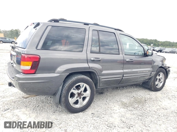 2004 Jeep Grand Cherokee Limited with VIN 1J8GX58N24C333403, listed as a Copart auction lot 73708764 with 145,471 mi miles and Salvage Title. Bid and sale history available at DreamBid. Image 3.