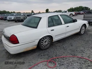2010 Mercury Grand Marquis LS z VIN 2MEBM7FV5AX606873, wystawiony jako IAAI lot #42216310 z przebiegiem 198 896 mil mil oraz . Historia ofert i sprzedaży dostępna na DreamBid. Obrazek 4.