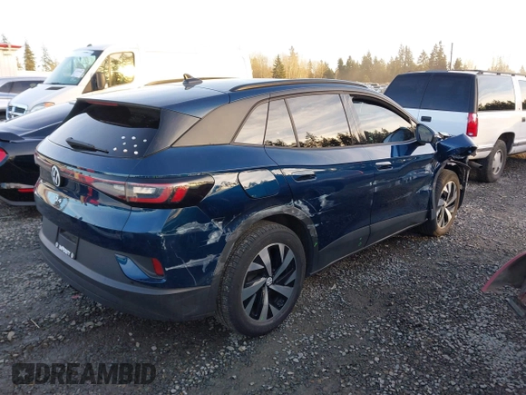 2023 Volkswagen ID.4 Pro z VIN 1V2DNPE81PC017620, wystawiony jako IAAI lot #41573053 z przebiegiem 15 462 mil mil oraz . Historia ofert i sprzedaży dostępna na DreamBid. Obrazek 4.