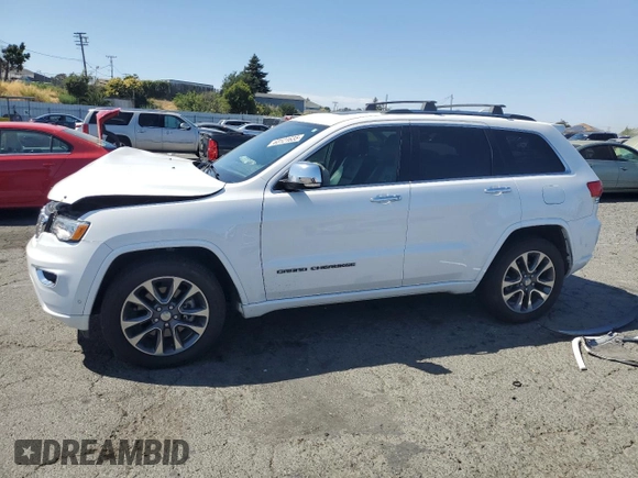 2017 Jeep Grand Cherokee Overland with VIN 1C4RJFCT5HC777748, listed as a Copart auction lot 63121635 with 106,991 mi miles and Salvage title. Bid and sale history available at DreamBid. Image 1.