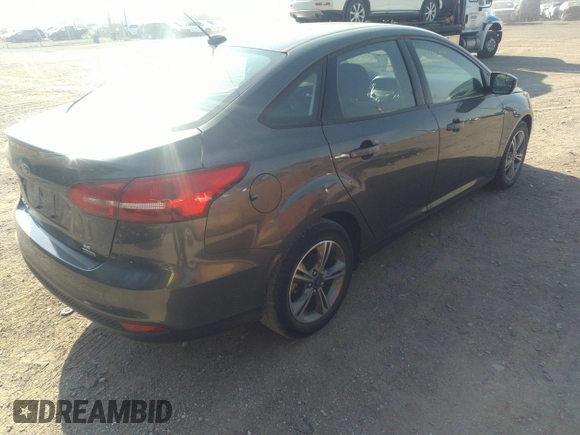 2017 Ford Focus SE with VIN 1FADP3FE3HL295192, listed as a IAAI auction lot 42664709 with 47,589 mi miles and . Bid and sale history available at DreamBid. Image 4.
