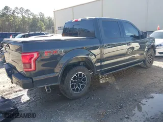 2016 Ford F-150 XLT with VIN 1FTEW1EF2GKE21353, listed as a IAAI auction lot 41209744 with 104,198 mi miles. Bid and sale history available at carsss.com. Image 4.