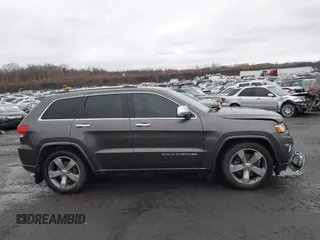 2015 Jeep Grand Cherokee Overland with VIN 1C4RJFCT3FC725239, listed as a IAAI auction lot 41779555 with 100,837 mi miles. Bid and sale history available at carsss.com. Image 13.