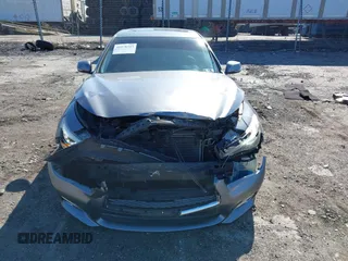 2015 Infiniti Q50 Premium with VIN JN1BV7AR2FM392399, listed as a IAAI auction lot 41978343 with 108,679 mi miles and . Bid and sale history available at DreamBid. Image 13.