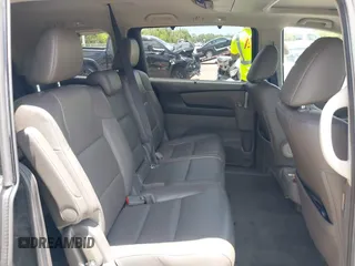 2013 Honda Odyssey Touring with VIN 5FNRL5H96DB068843, listed as a IAAI auction lot 42312176 with 115,804 mi miles and . Bid and sale history available at DreamBid. Image 8.