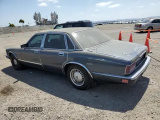 1992 Jaguar XJ with VIN SAJHY174XNC649368, listed as a Copart auction lot 50191454 with 99,553 mi miles and Salvage Title. Bid and sale history available at DreamBid. Image 2.