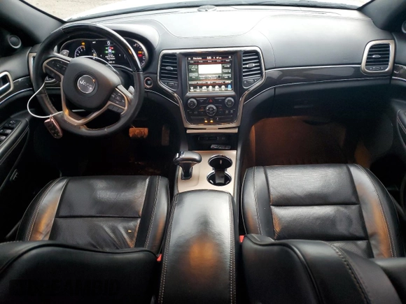 2014 Jeep Grand Cherokee Overland with VIN 1C4RJFCG7EC572298, listed as a Copart auction lot 83970004 with 104,861 mi miles and Salvage Title. Bid and sale history available at DreamBid. Image 8.