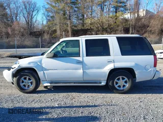 2000 Cadillac Escalade z VIN 1GYEK63R7YR219133, wystawiony jako IAAI lot #41585673 z przebiegiem 184 738 mil mil oraz . Historia ofert i sprzedaży dostępna na DreamBid. Obrazek 14.