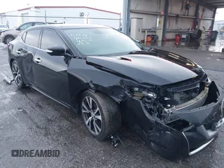 2016 Nissan Maxima Platinum z VIN 1N4AA6AP5GC410517, wystawiony jako IAAI lot #41052694 z przebiegiem 118 687 mil mil oraz . Historia ofert i sprzedaży dostępna na DreamBid. Obrazek 1.