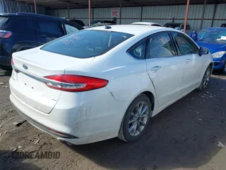 2017 Ford Fusion SE z VIN 3FA6P0H77HR277995, wystawiony jako IAAI lot #41586483 z przebiegiem 191 912 mil mil oraz . Historia ofert i sprzedaży dostępna na DreamBid. Obrazek 4.