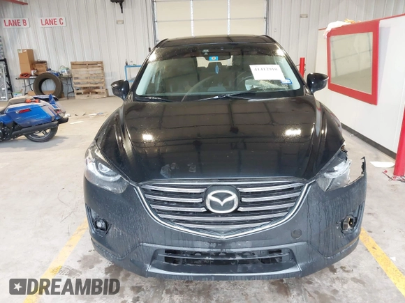 2016 Mazda CX-5 Grand Touring with VIN JM3KE2DY9G0705127, listed as a IAAI auction lot 41412910 with 181,993 mi miles. Bid and sale history available at carsss.com. Image 12.