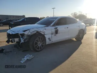 2022 Genesis G70 3.3T with VIN KMTG54TE5NU094831, listed as a Copart auction lot 83879004 with 57,449 mi miles and Salvage Title. Bid and sale history available at DreamBid. Image 1.
