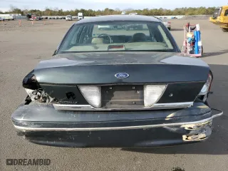1999 Ford Crown Victoria LX with VIN 2FAFP74W7XX214966, listed as a Copart auction lot 80337724 with 134,624 mi miles and Salvage Title. Bid and sale history available at carsss.com. Image 6.