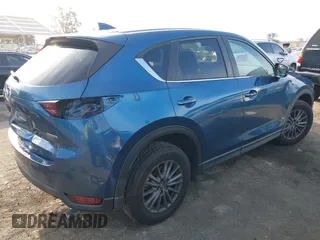 2021 Mazda CX-5 Touring with VIN JM3KFACM5M0332718, listed as a IAAI auction lot 41905933 with 30,930 mi miles. Bid and sale history available at carsss.com. Image 4.