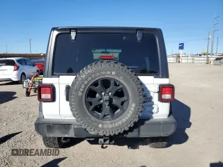 2022 Jeep Wrangler Unlimited High Tide with VIN 1C4HJXDG2NW102145, listed as a Copart auction lot 41407225 with 43,921 mi miles and Salvage Title. Bid and sale history available at DreamBid. Image 6.