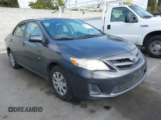 2011 Toyota Corolla L with VIN JTDBU4EE7B9162022, listed as a IAAI auction lot 42066643 with 124,384 mi miles. Bid and sale history available at carsss.com. Image 1.