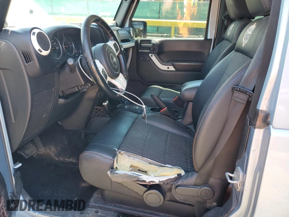 2012 Jeep Wrangler Arctic z VIN 1C4AJWBGXCL156600, wystawiony jako Copart lot #56369065 z przebiegiem 216 808 mil mil oraz Szkoda całkowita • Salvage title. Historia ofert i sprzedaży dostępna na DreamBid. Obrazek 7.
