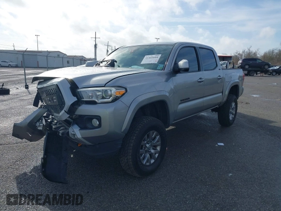 2018 Toyota Tacoma SR5 with VIN 5TFAZ5CN6JX057889, listed as a IAAI auction lot 41449604 with 114,888 mi miles and . Bid and sale history available at DreamBid. Image 2.