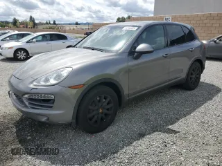 2014 Porsche Cayenne with VIN WP1AA2A27ELA92869, listed as a Copart auction lot 51244305 with 121,756 mi miles and Clean Title. Bid and sale history available at DreamBid. Image 1.