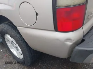 2004 Chevrolet Tahoe LT z VIN 1GNEC13Z74R233346, wystawiony jako IAAI lot #42095020 z przebiegiem 123 257 mil mil oraz . Historia ofert i sprzedaży dostępna na DreamBid. Obrazek 19.