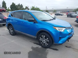2018 Toyota RAV4 LE with VIN 2T3BFREV6JW740214, listed as a IAAI auction lot 42106349 with 105,831 mi miles. Bid and sale history available at carsss.com. Image 1.