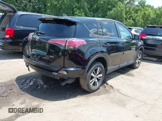 2018 Toyota RAV4 XLE with VIN 2T3WFREV3JW468450, listed as a IAAI auction lot 42528560 with 77,513 mi miles and . Bid and sale history available at DreamBid. Image 4.