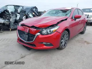 2018 Mazda 3 Touring with VIN 3MZBN1L37JM167604, listed as a IAAI auction lot 41623232 with 118,974 mi miles. Bid and sale history available at carsss.com. Image 19.
