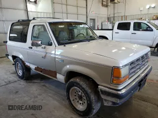 1990 Ford Bronco z VIN 1FMCU14T9LUA62663, wystawiony jako Copart lot #85040114 z przebiegiem 9 963 mil mil oraz Czysty tytuł • Clean title. Historia ofert i sprzedaży dostępna na DreamBid. Obrazek 4.