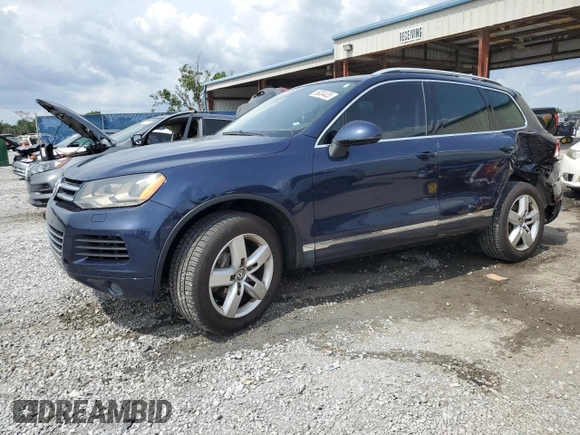 2013 Volkswagen Touareg Lux с VIN WVGEF9BP0DD002456, выставлен на аукционе Copart как лот 56034435 с пробегом 131 412 миль миль и Списание • Salvage title. История ставок и продаж доступна на DreamBid. Изображение 1.