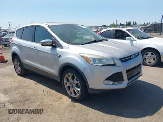 2013 Ford Escape SEL z VIN 1FMCU9H95DUC87631, wystawiony jako IAAI lot #42564756 z przebiegiem 144 467 mil mil oraz . Historia ofert i sprzedaży dostępna na DreamBid. Obrazek 1.