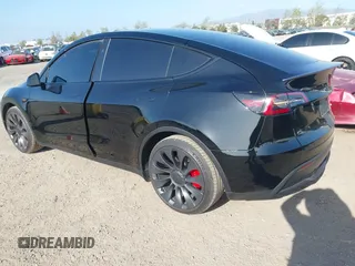 2023 Tesla Model Y Performance with VIN 7SAYGDEF4PF809308, listed as a IAAI auction lot 42056769 with 12,101 mi miles and . Bid and sale history available at DreamBid. Image 2.