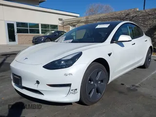 2023 Tesla Model 3 with VIN 5YJ3E1EA6PF411940, listed as a IAAI auction lot 41829537 with 32,877 mi miles and . Bid and sale history available at carsss.com. Image 2.