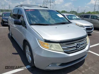 2011 Honda Odyssey Touring with VIN 5FNRL5H99BB058448, listed as a IAAI auction lot 42651432 with 208,581 mi miles and . Bid and sale history available at DreamBid. Image 1.