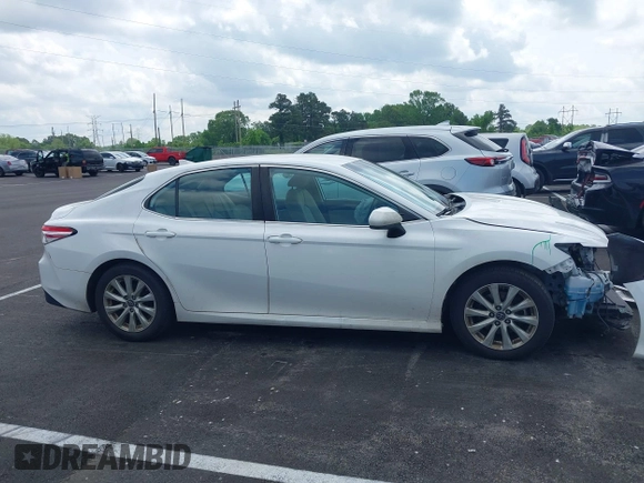 2019 Toyota Camry LE with VIN 4T1B11HK2KU743445, listed as a IAAI auction lot 42129688 with 284,938 mi miles and . Bid and sale history available at DreamBid. Image 13.