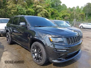 2014 Jeep Grand Cherokee SRT-8 z VIN 1C4RJFDJ2EC174412, wystawiony jako IAAI lot #42116541 z przebiegiem 124 693 mil mil oraz . Historia ofert i sprzedaży dostępna na DreamBid. Obrazek 1.