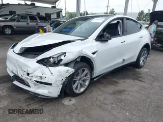 2022 Tesla Model Y Long Range with VIN 7SAYGDEE3NF518061, listed as a IAAI auction lot 41896233 with 34,714 mi miles and . Bid and sale history available at carsss.com. Image 2.