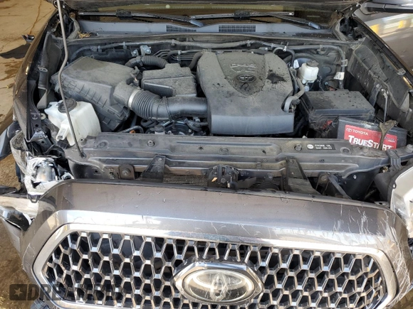 2019 Toyota Tacoma SR z VIN 3TMCZ5AN8KM197011, wystawiony jako Copart lot #56198675 z przebiegiem 117 363 mil mil oraz Szkoda całkowita • Salvage title. Historia ofert i sprzedaży dostępna na DreamBid. Obrazek 11.