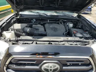 2019 Toyota Tacoma SR z VIN 3TMCZ5AN1KM253032, wystawiony jako Copart lot #52598445 z przebiegiem 69 489 mil mil oraz Szkoda całkowita • Salvage title. Historia ofert i sprzedaży dostępna na DreamBid. Obrazek 11.