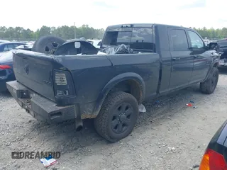 2018 Ram 2500 Laramie with VIN 3C6UR5NLXJG256688, listed as a IAAI auction lot 42168537 with 214,596 mi miles and . Bid and sale history available at DreamBid. Image 4.