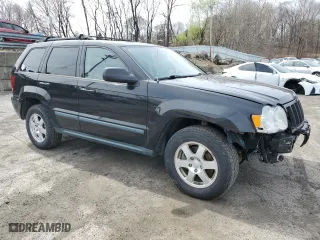 2009 Jeep Grand Cherokee Laredo with VIN 1J8GR48K79C537213, listed as a Copart auction lot 51222395 with 148,838 mi miles and Salvage Title. Bid and sale history available at carsss.com. Image 4.
