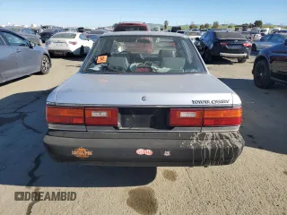 1988 Toyota Camry z VIN JT2SV24E5J3276324, wystawiony jako Copart lot #88117355 z przebiegiem 89 928 mil mil oraz Szkoda całkowita • Salvage title. Historia ofert i sprzedaży dostępna na DreamBid. Obrazek 6.