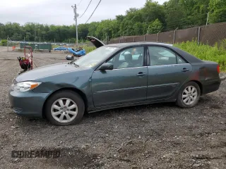 2002 Toyota Camry LE z VIN 4T1BE30KX2U533316, wystawiony jako Copart lot #57965275 z przebiegiem 98 273 mil mil oraz Szkoda całkowita • Salvage title. Historia ofert i sprzedaży dostępna na DreamBid. Obrazek 1.