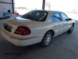 2000 Lincoln Continental with VIN 1LNHM97V9YY821894, listed as a IAAI auction lot 41657199 with 218,330 mi miles. Bid and sale history available at carsss.com. Image 4.