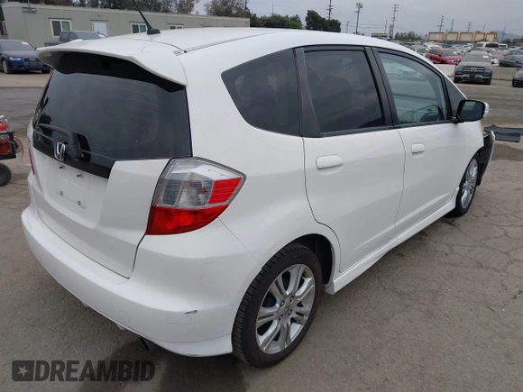 2009 Honda Fit Sport with VIN JHMGE88409S021730, listed as a IAAI auction lot 42045023 with 309,995 mi miles. Bid and sale history available at carsss.com. Image 4.