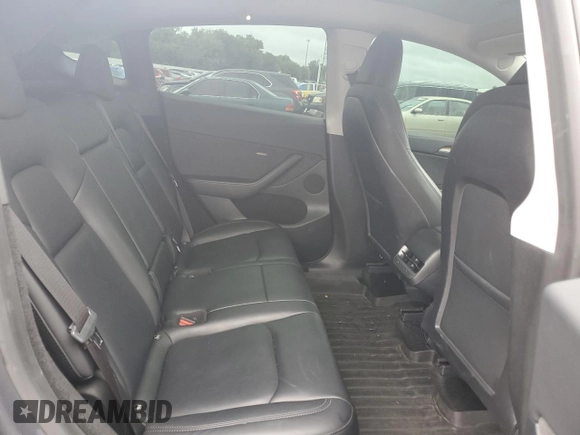2023 Tesla Model Y Long Range z VIN 7SAYGDEE4PF752292, wystawiony jako Copart lot #53824185 z przebiegiem 61 470 mil mil oraz Szkoda całkowita • Salvage title. Historia ofert i sprzedaży dostępna na DreamBid. Obrazek 10.