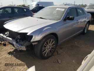2014 Chrysler 300 C with VIN 2C3CCAKG3EH157999, listed as a Copart auction lot 74798564 with 136,277 mi miles and Salvage Title. Bid and sale history available at carsss.com. Image 1.