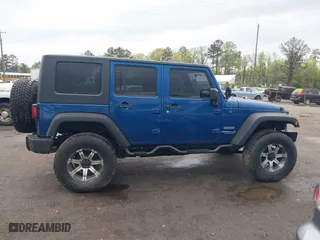 2010 Jeep Wrangler Unlimited Sport with VIN 1J4BA3H11AL144560, listed as a IAAI auction lot 42013032 with 226,233 mi miles. Bid and sale history available at carsss.com. Image 13.