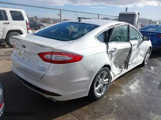 2015 Ford Fusion Titanium Hybrid with VIN 3FA6P0RU9FR308973, listed as a IAAI auction lot 41754320 with 82,686 mi miles. Bid and sale history available at carsss.com. Image 4.